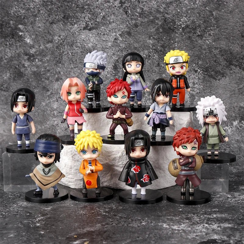 Twelve chibi Naruto figures including Kakashi, Hinata, Itachi in his Akatsuki cloak and Gaara on a stone display